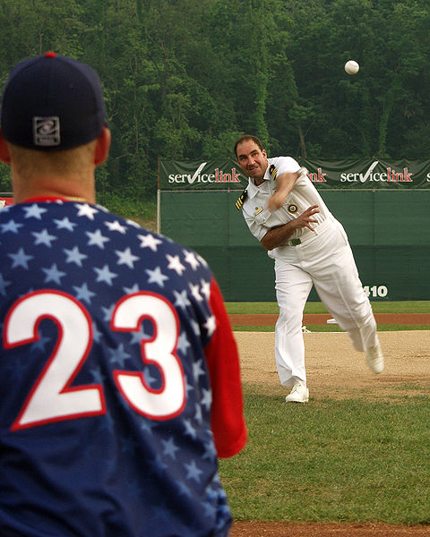 This photo shows the number 23 on the back of a baseball player about to make a catch.